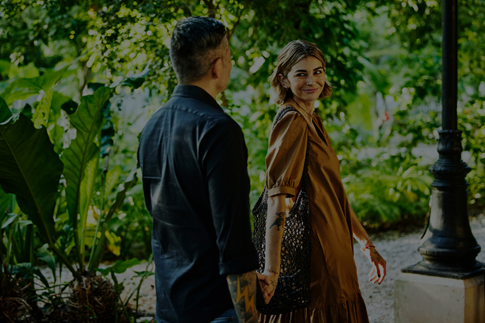 Young couple walking together holding hands