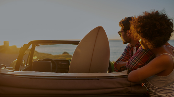 Image of couple with surfboard