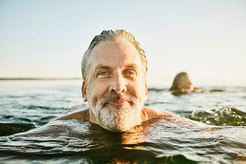 Image of man swimming in sea