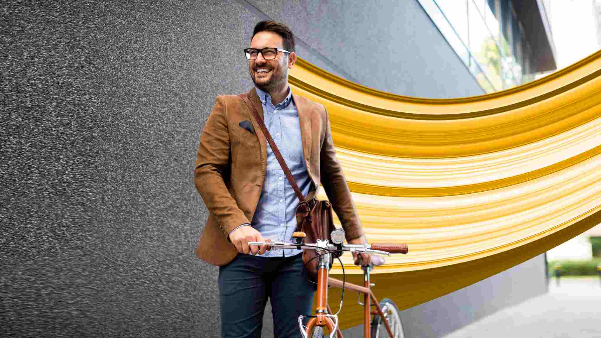 Man with bike and Wesleyan whoosh behind him