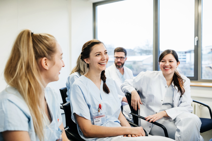 Medical students in room wearing scrubs