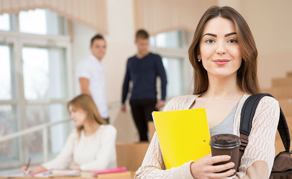 Dental student with yellow folder