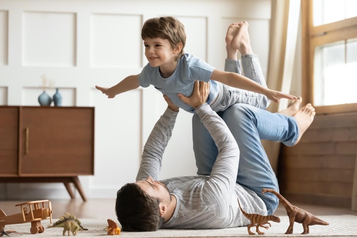 Father playing with toddler son