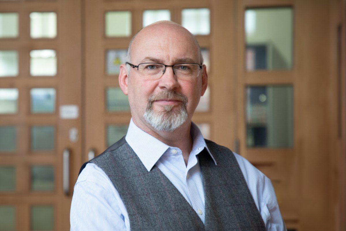 Gary Dixon smiling in Wesleyan office