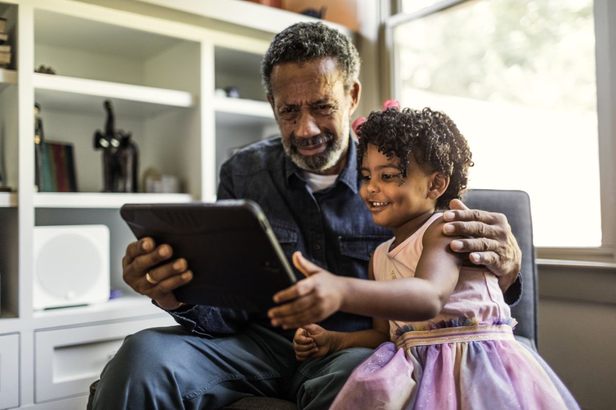 Father and daughter using tablet