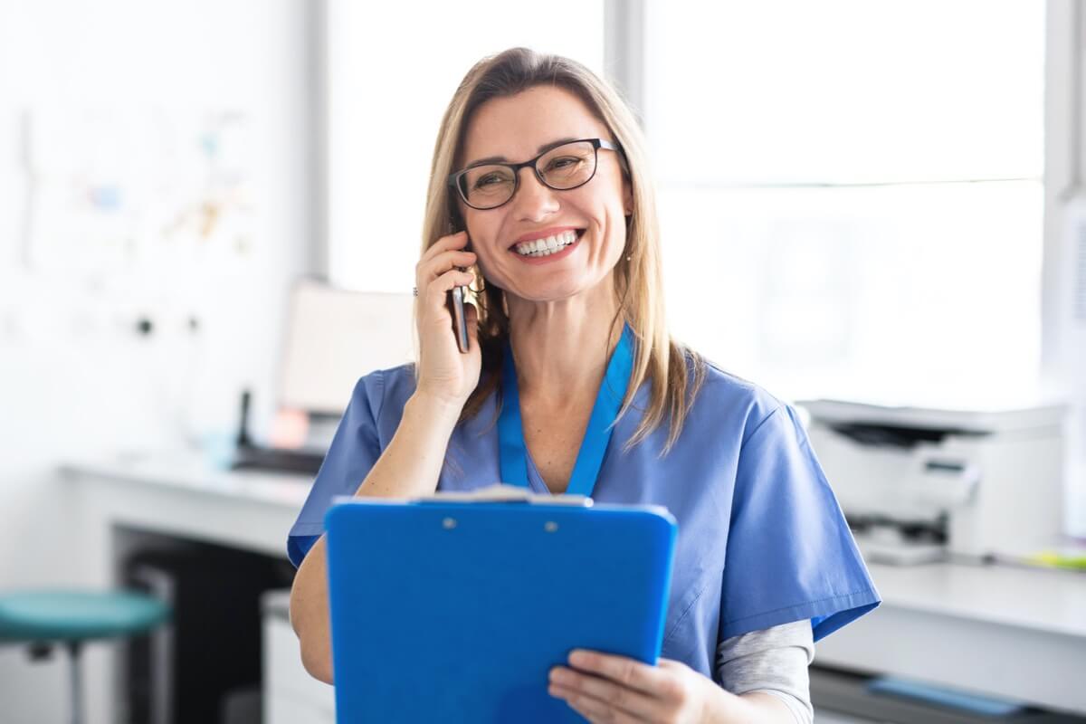 Female dentist talking on phone