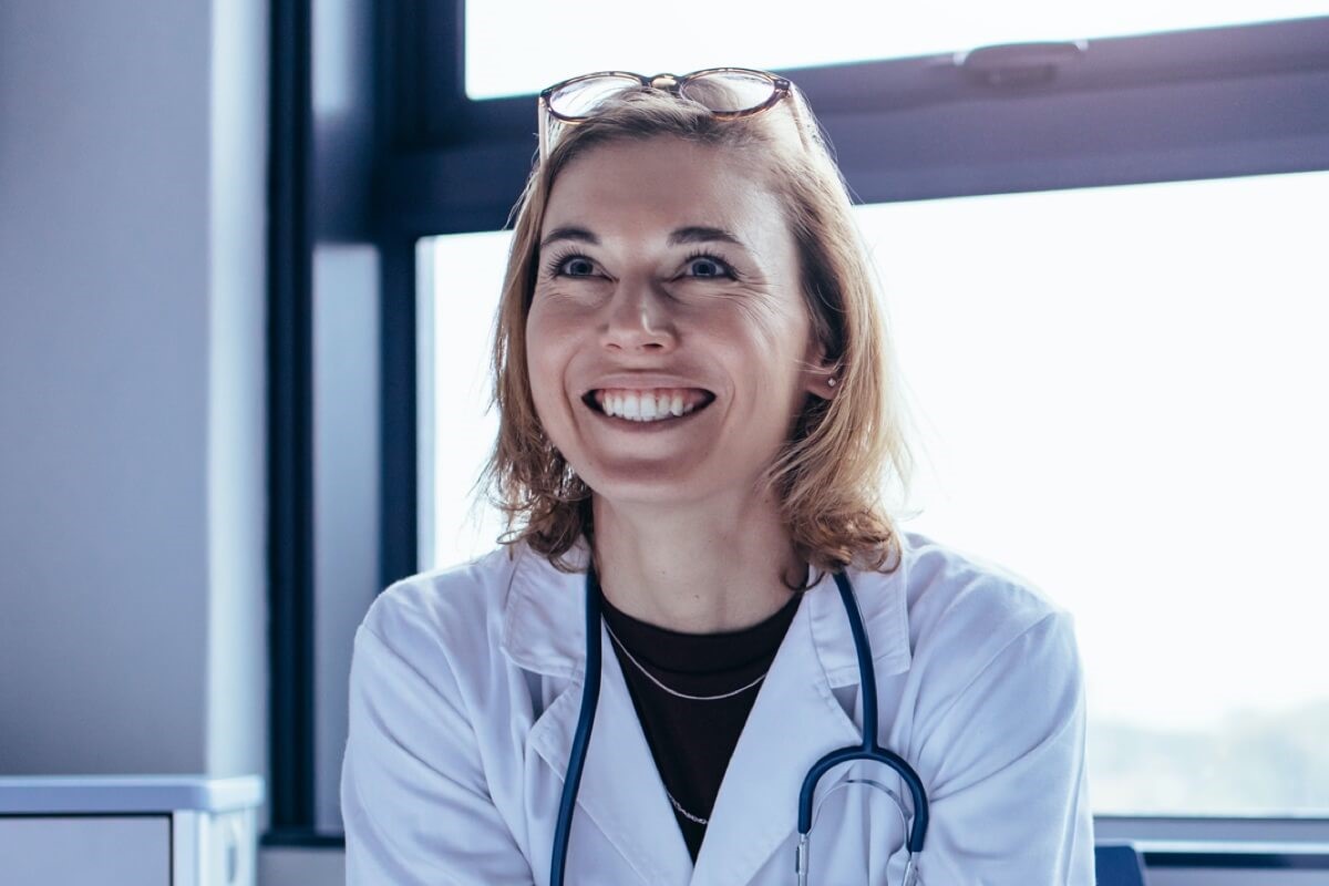 Female doctor smiling in distance