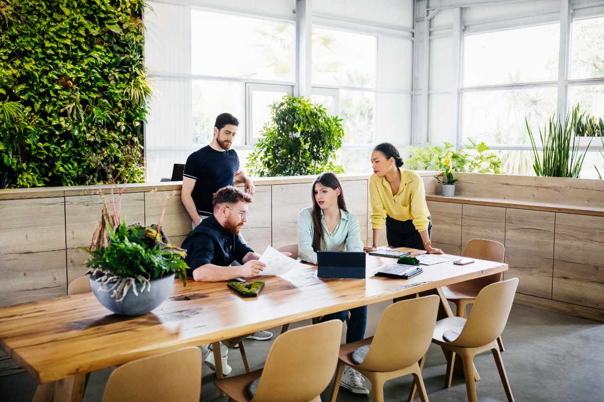 Group of professionals having a discussion in an office Group of professionals having a discussion in an office