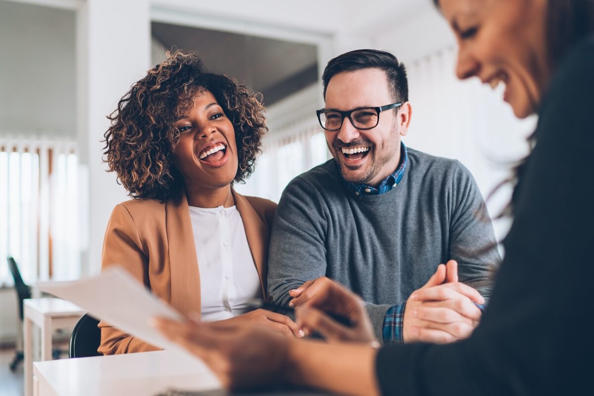 Happy couple getting financial advice