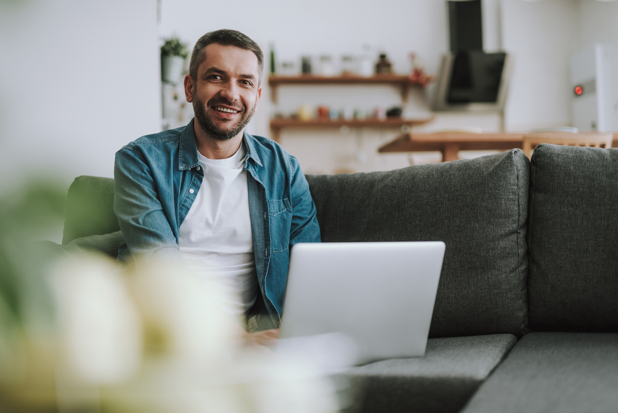 Male sitting on the sofa smiling