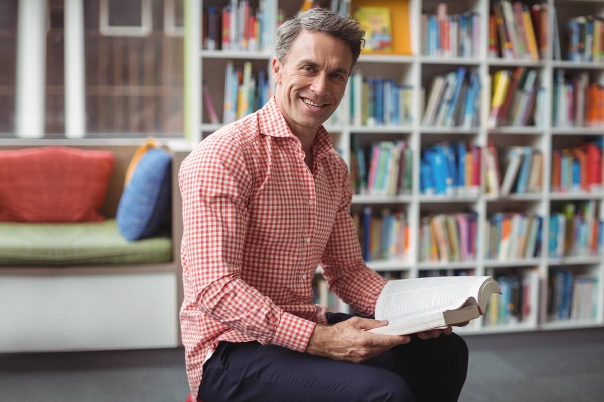 Male teacher in library