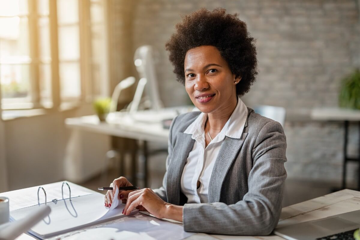 Professional female at desk with paperwork