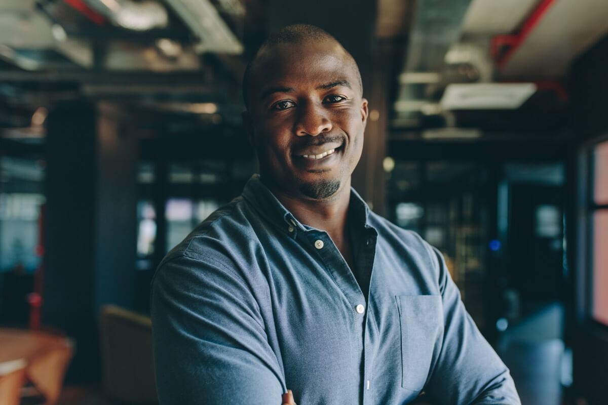 Professional man smiling in modern office