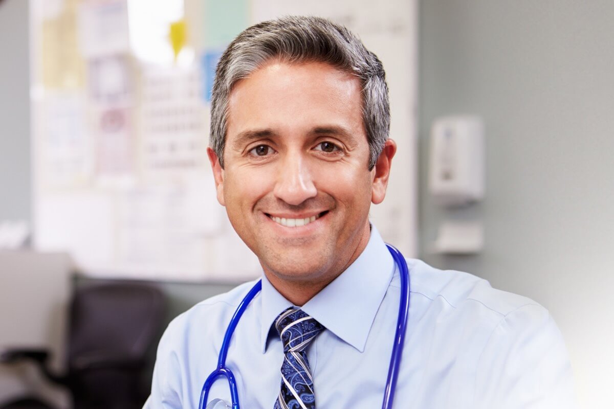 Smart male doctor smiling