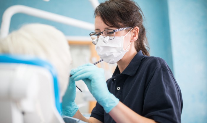 Female dentist working on patient