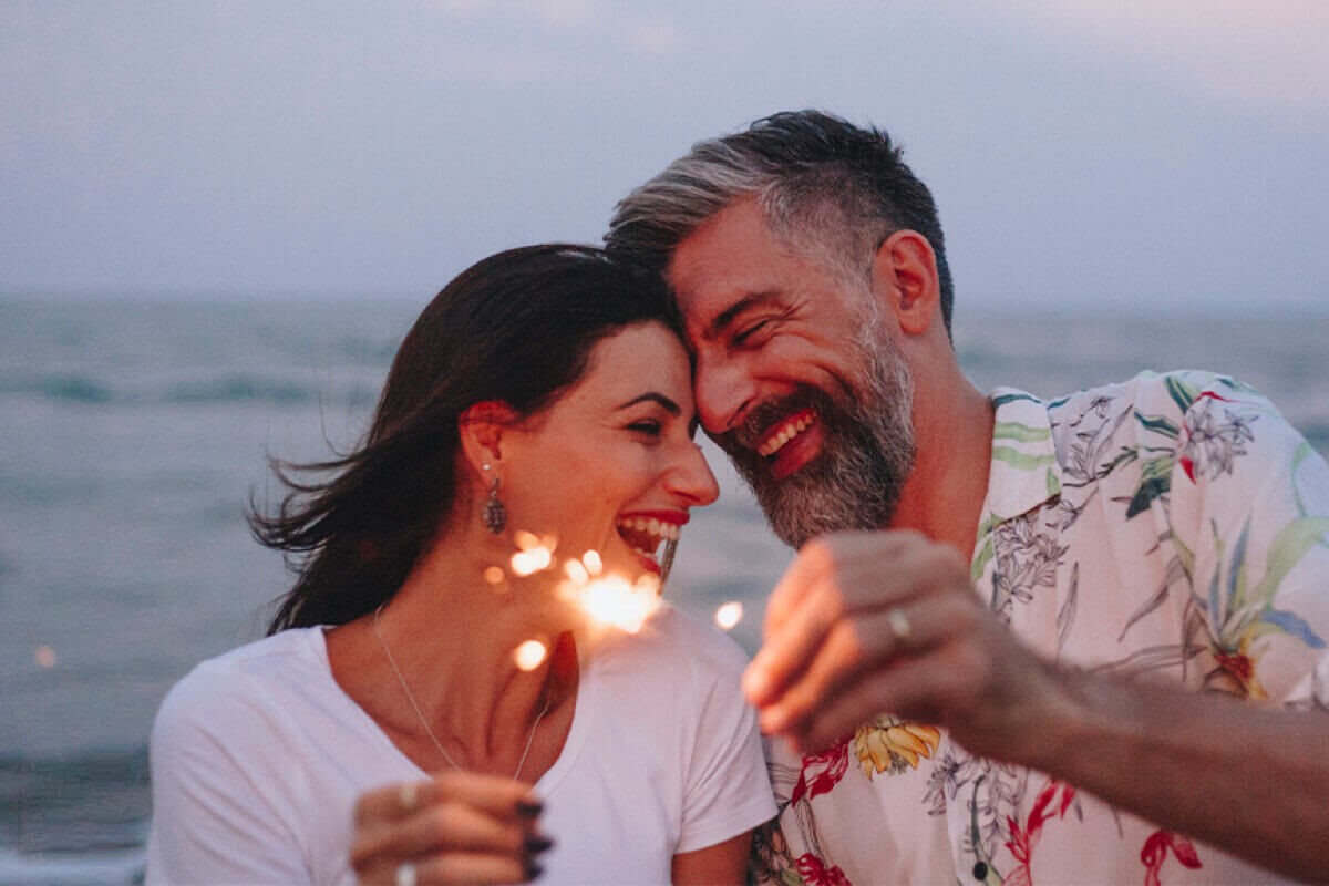 Mature couple holding sparkler