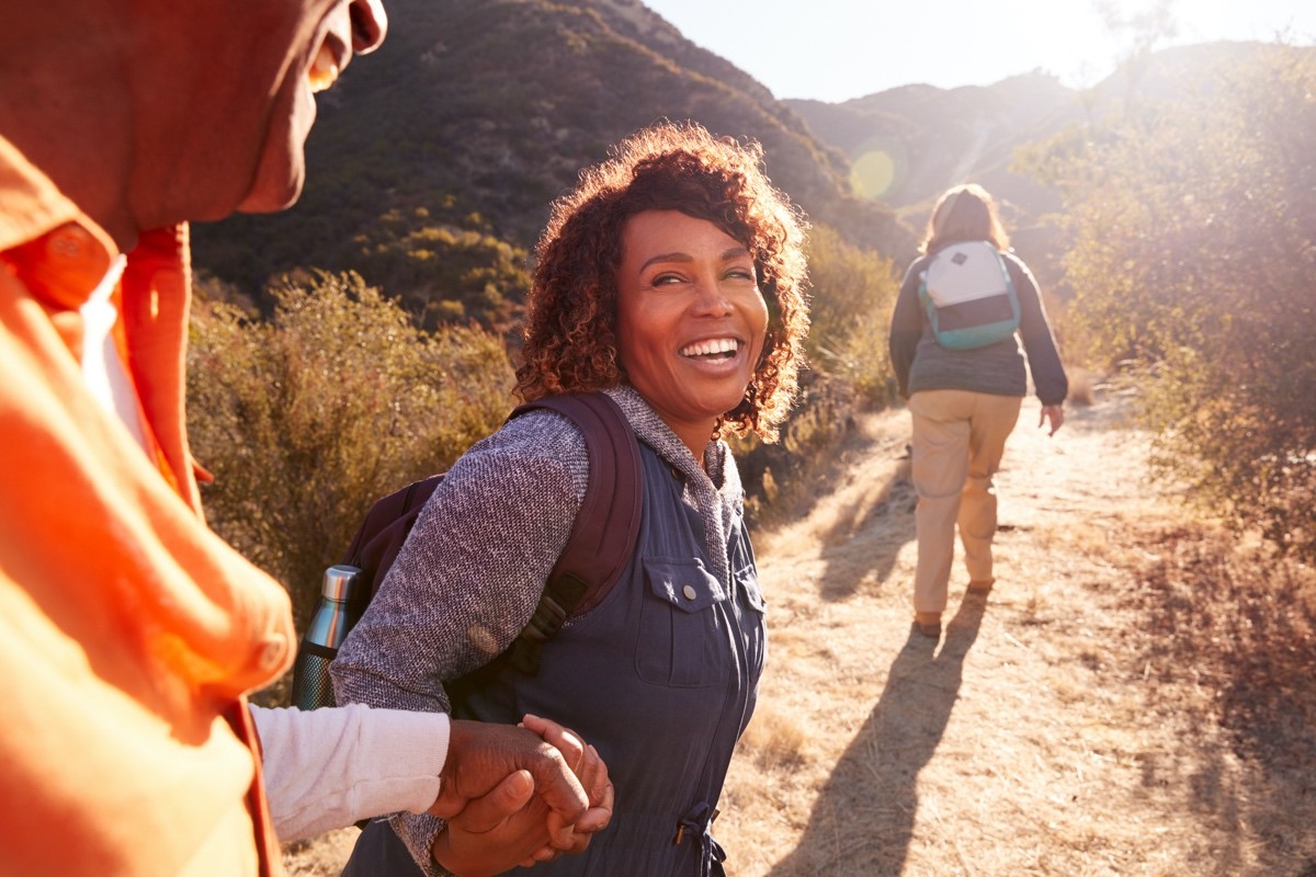 Mature woman laughing on walk