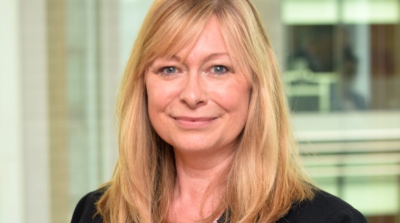 Judith Husband smiling in Wesleyan office