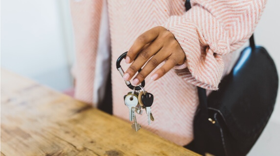 Shot of woman's hands holding a set of keys