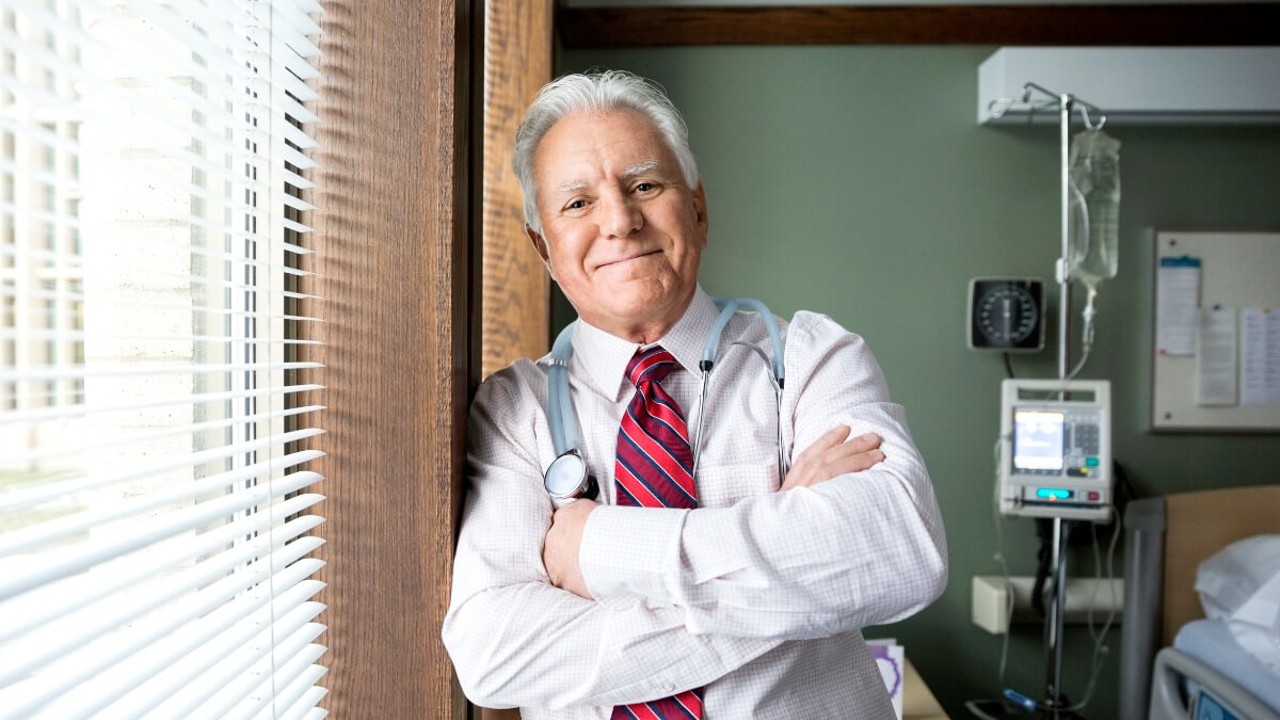 Mature male medical professional in hospital room