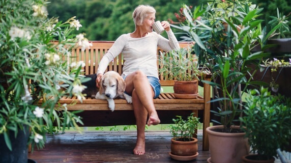 Mature woman relaxing in garden