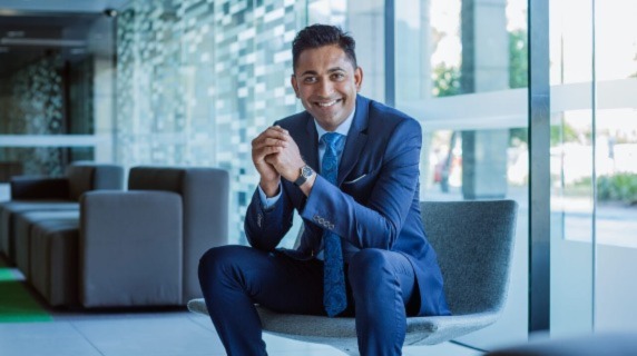 Smart professional man in suit sitting on office chair