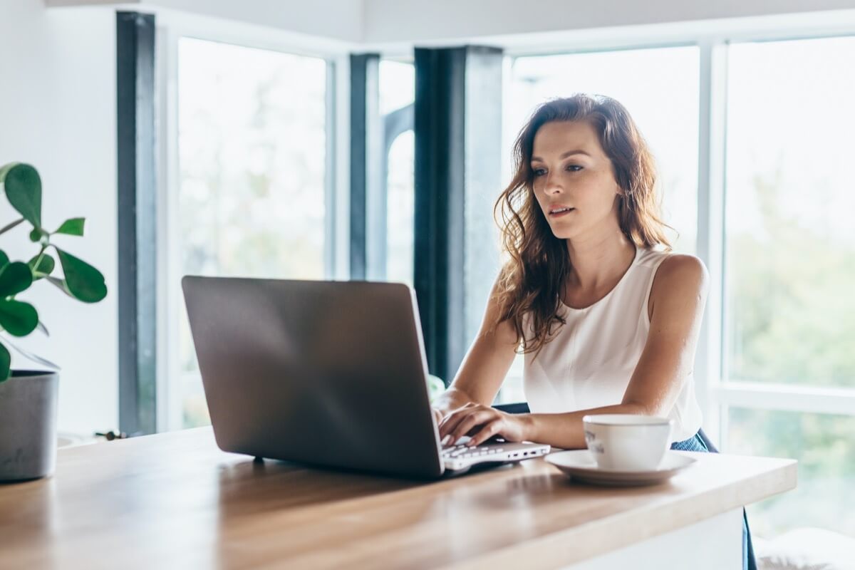 Woman typing on laptop