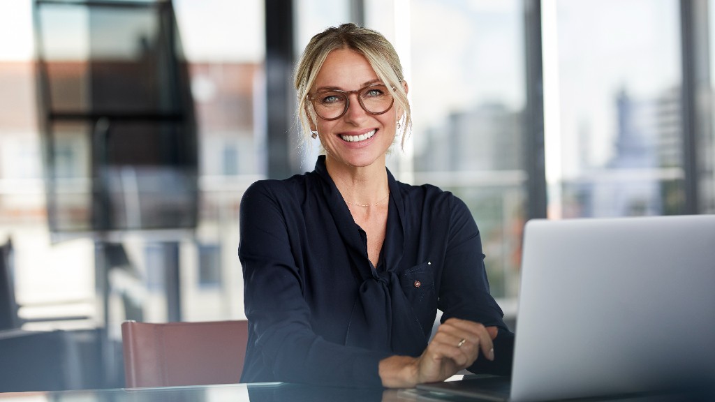 Young female professional wearing glasses smiling