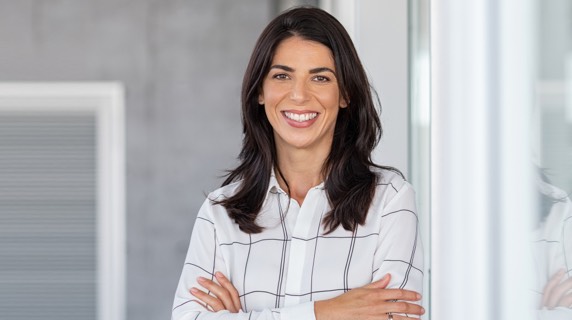 Young professional woman smiling in office