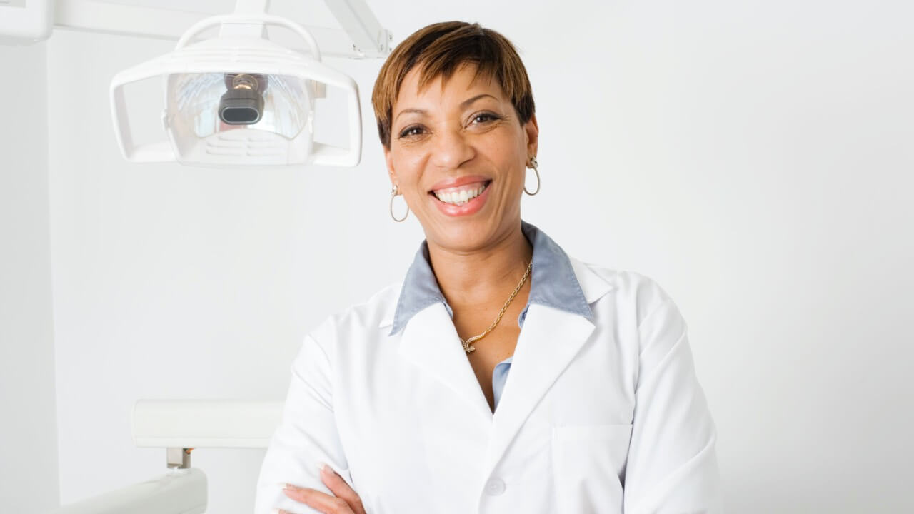 Female dentist with big smile