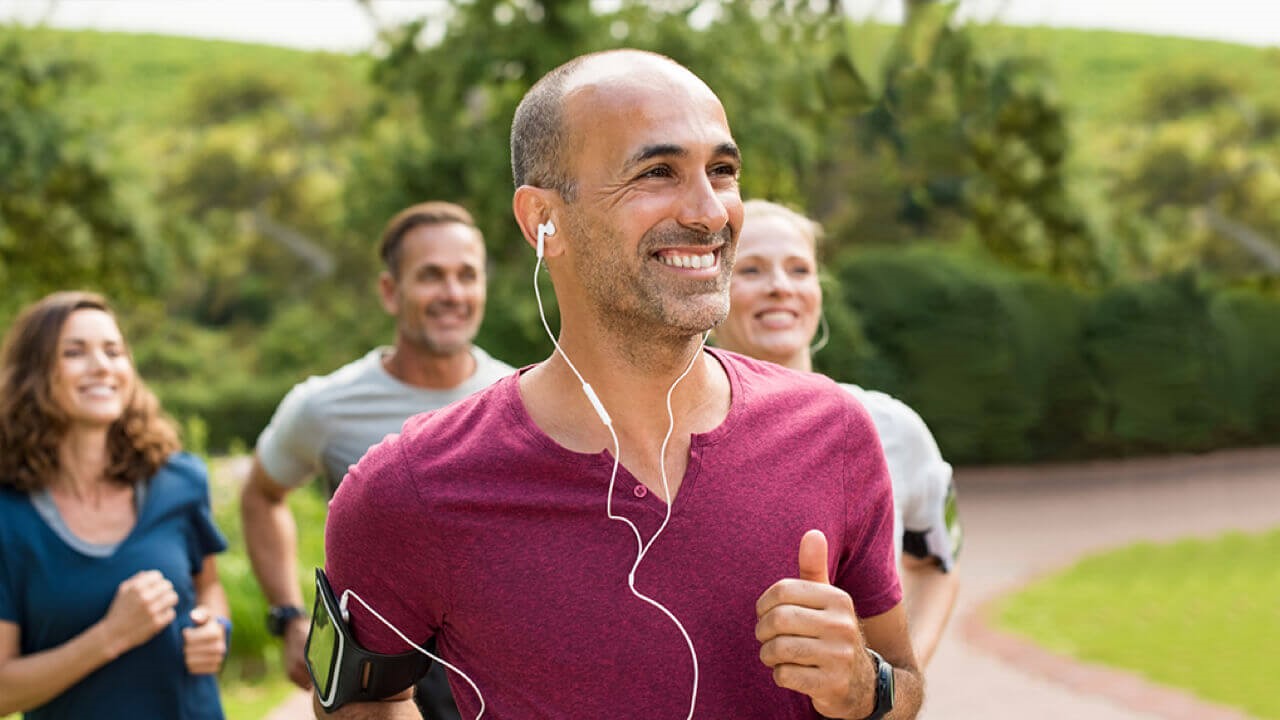 Man jogging with earphones in