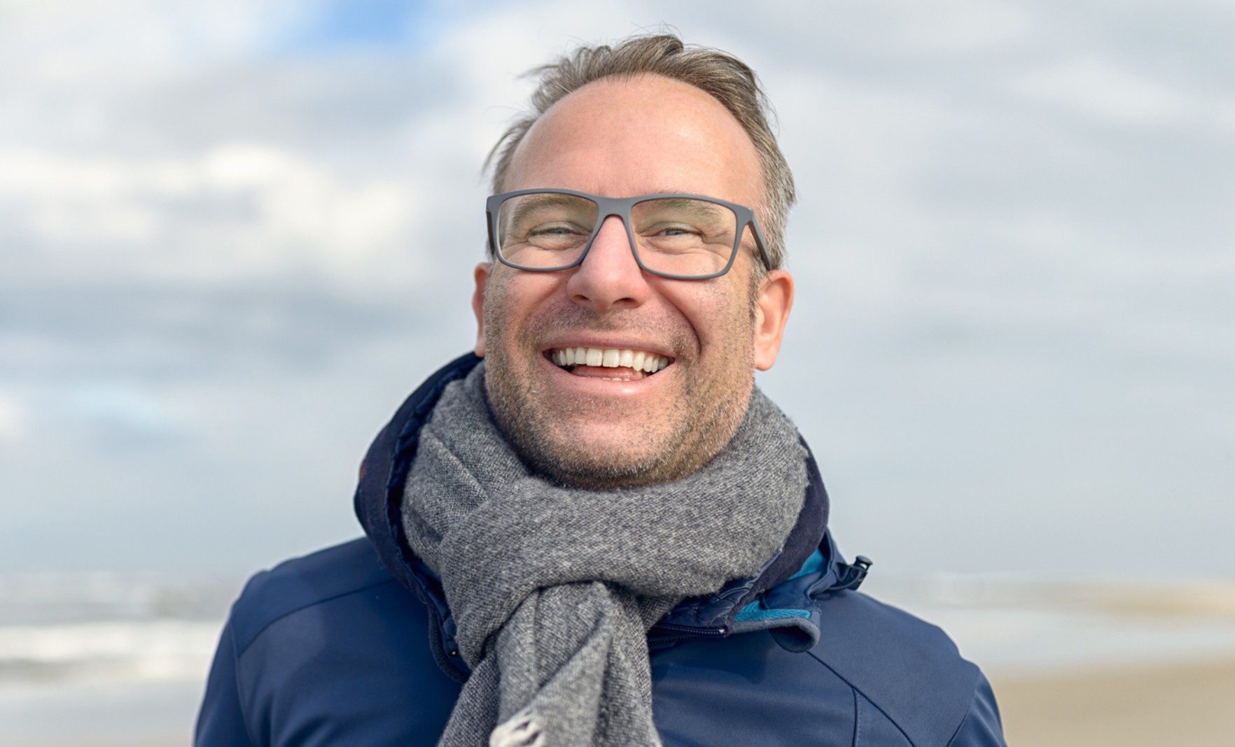 Male with glasses on beach