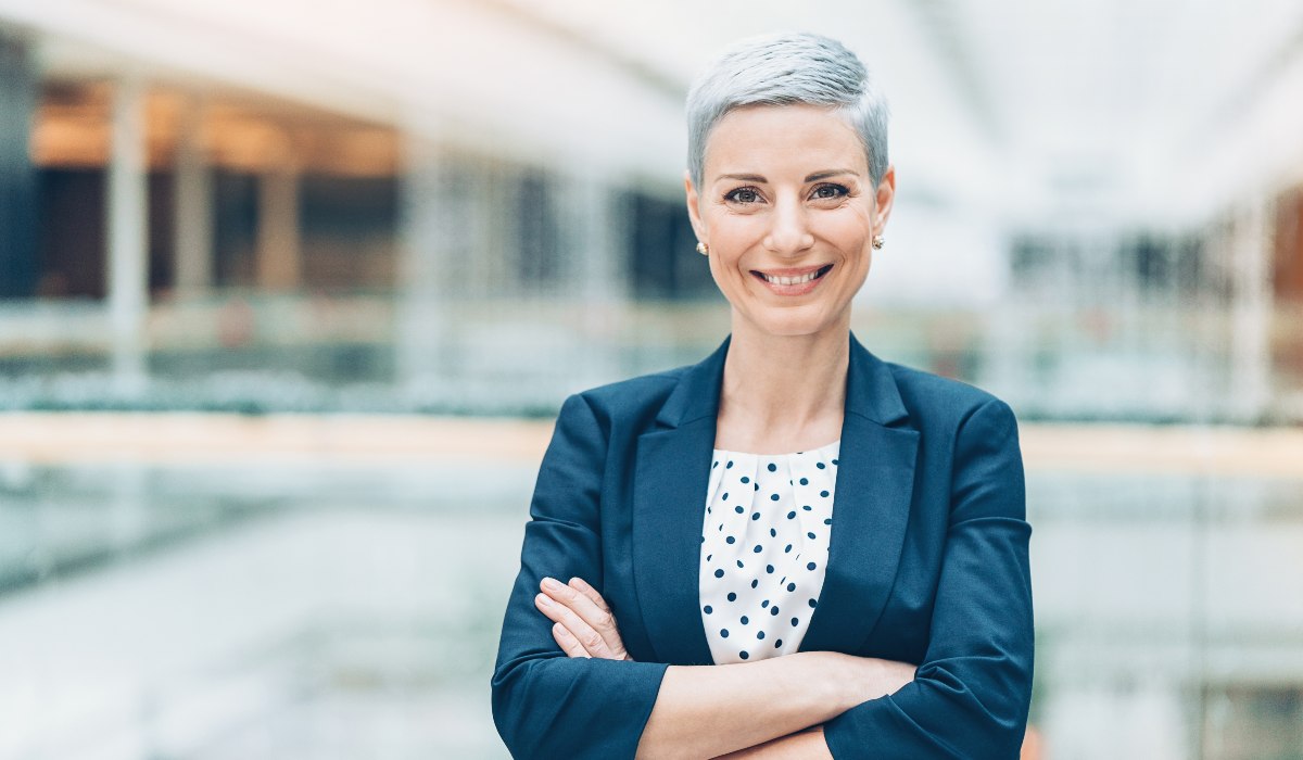 Professional woman standing with crossed arms