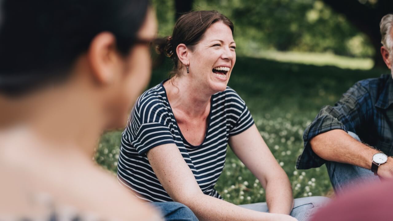 Woman with friends in park