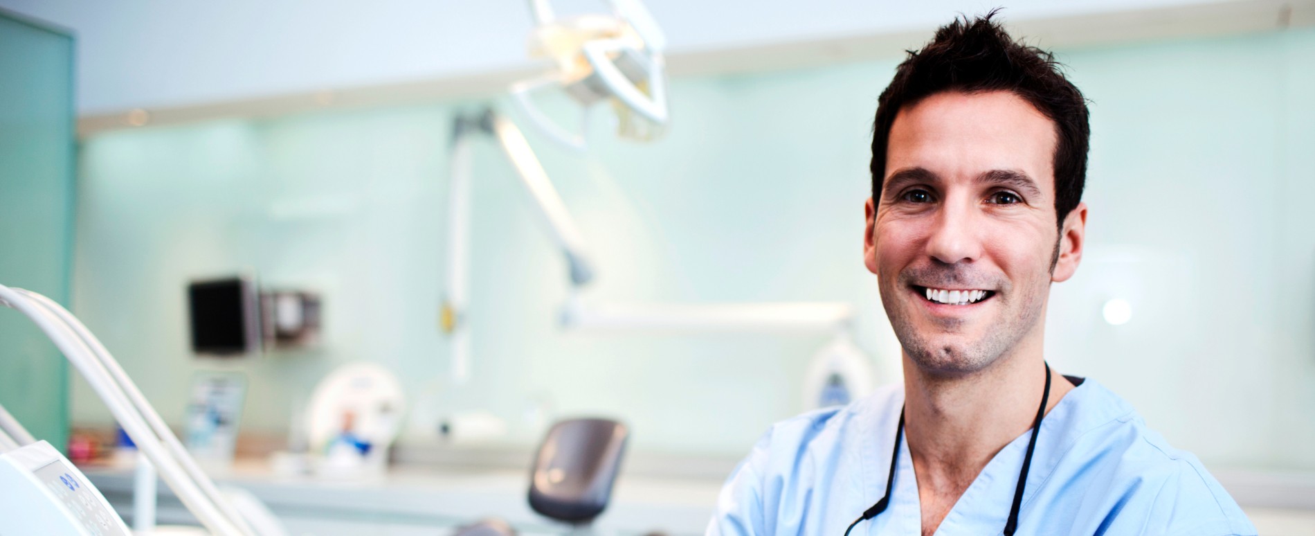 Male dentist smiling