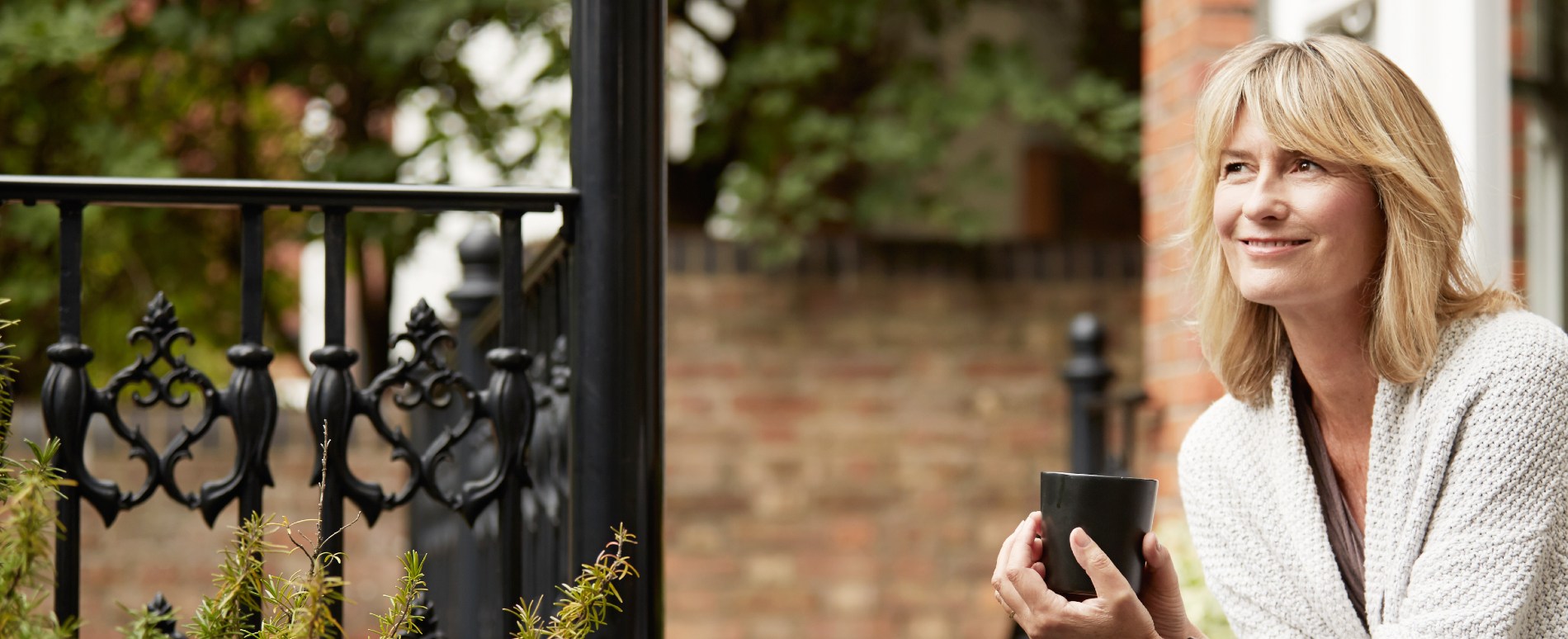 Female enjoying garden of property