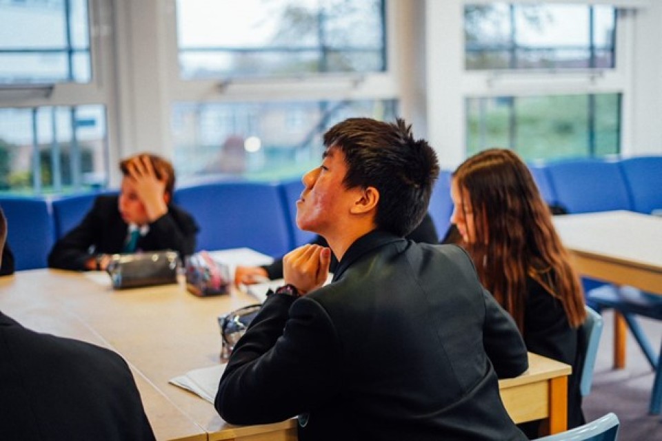 Students sat around a table at an after school club