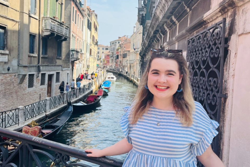 Dr Danielle Sutherland posing on a bridge in Venice