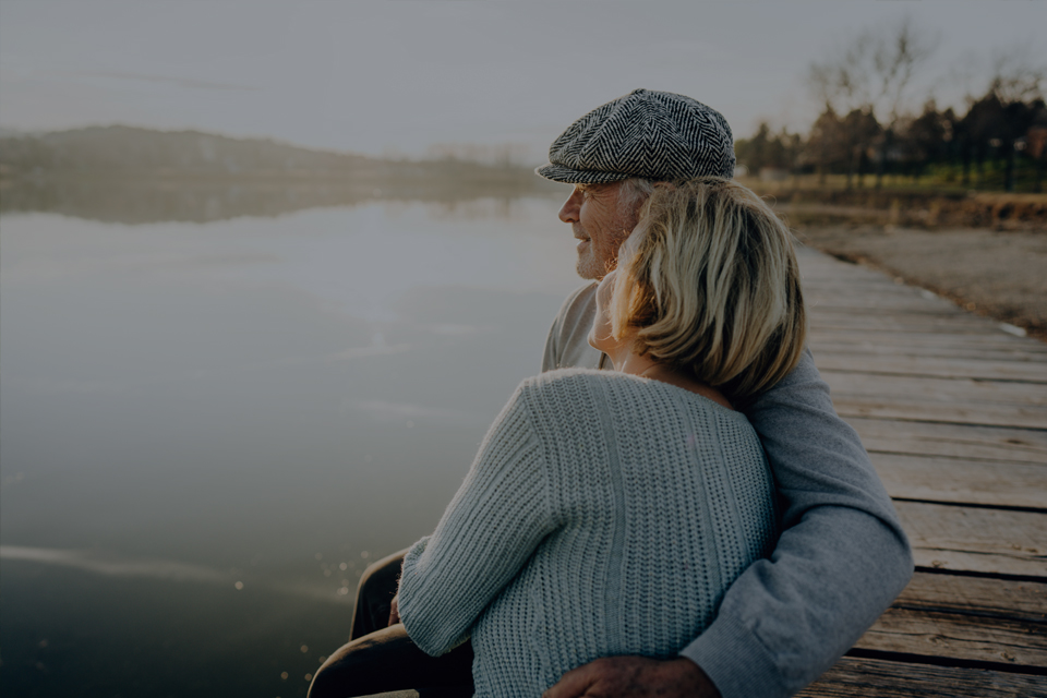 Mature couple looking out over a river